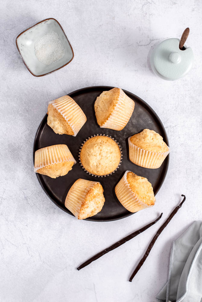 Perfectly domed vanilla cupcakes on a plate