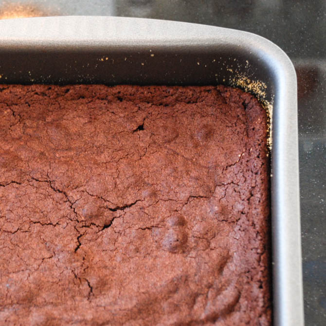 Chocolate brownies decorated with a spider web pattern