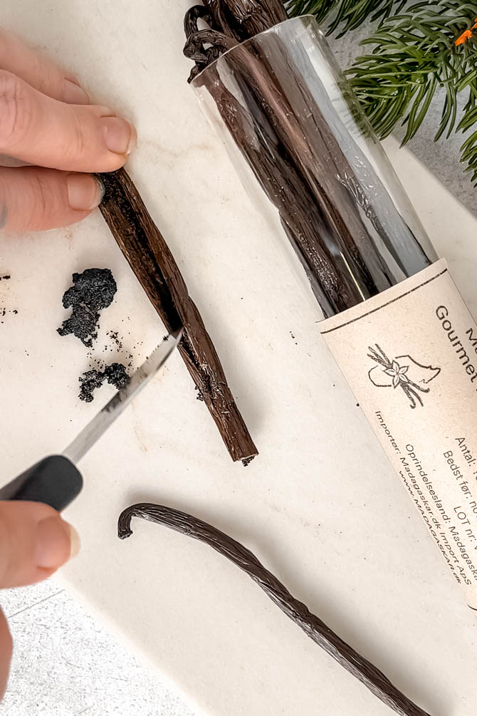 Whole Madagascar vanilla bean pod on a surface