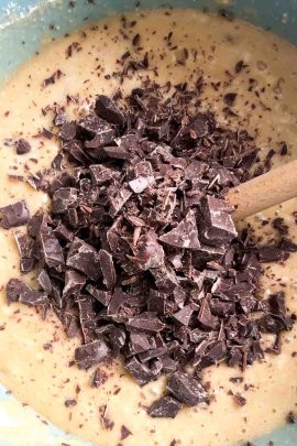 Chocolate chips being added to banana cake batter