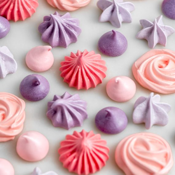 Meringue kisses on a baking sheet before baking