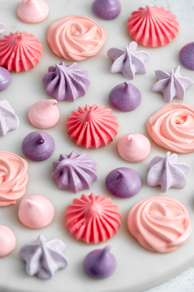 Meringue kisses on a baking sheet before baking