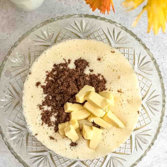 Banana cake batter being mixed in a bowl