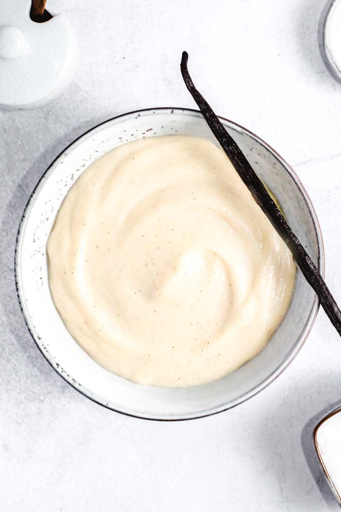 Bowl of vanilla pastry cream, smooth and pale yellow