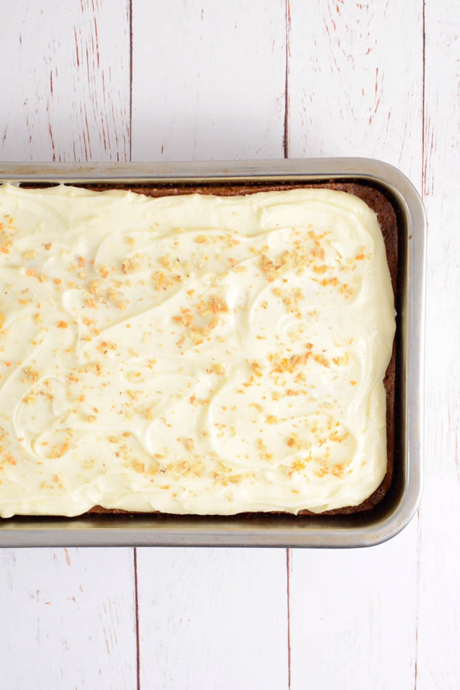 Carrot cake with cream cheese frosting cut into squares