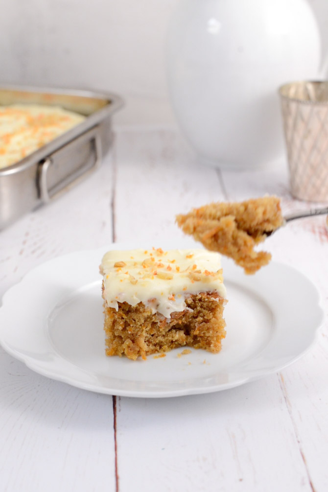 Slice of carrot cake with cream cheese frosting