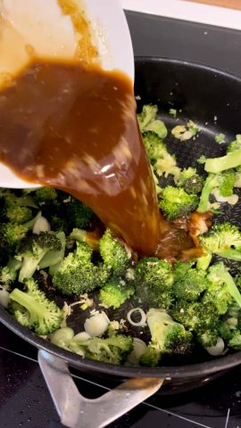 Cashew chicken sauce simmering with chicken pieces
