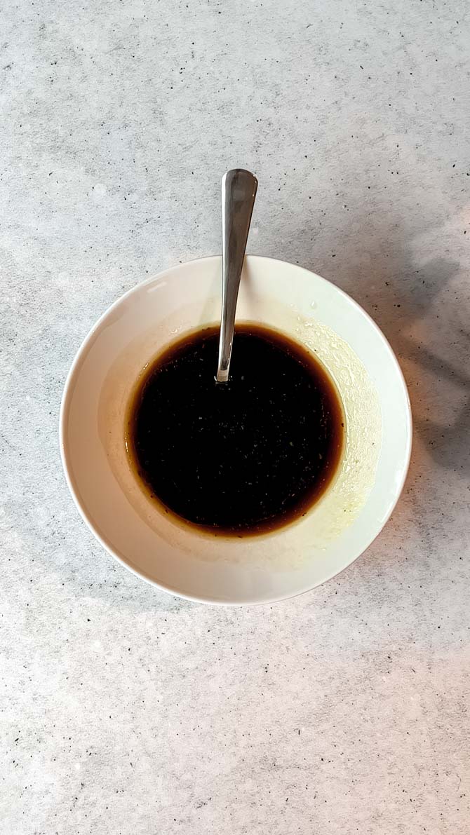 Chicken cashew coated in sauce in a pan