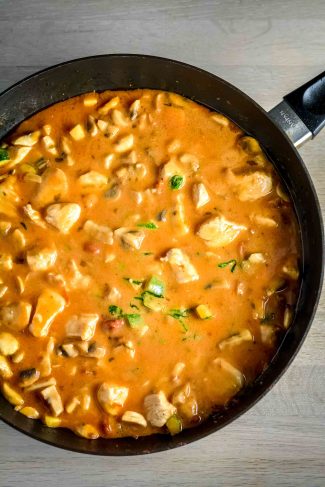 Creamy sauce coating pasta and chicken pieces