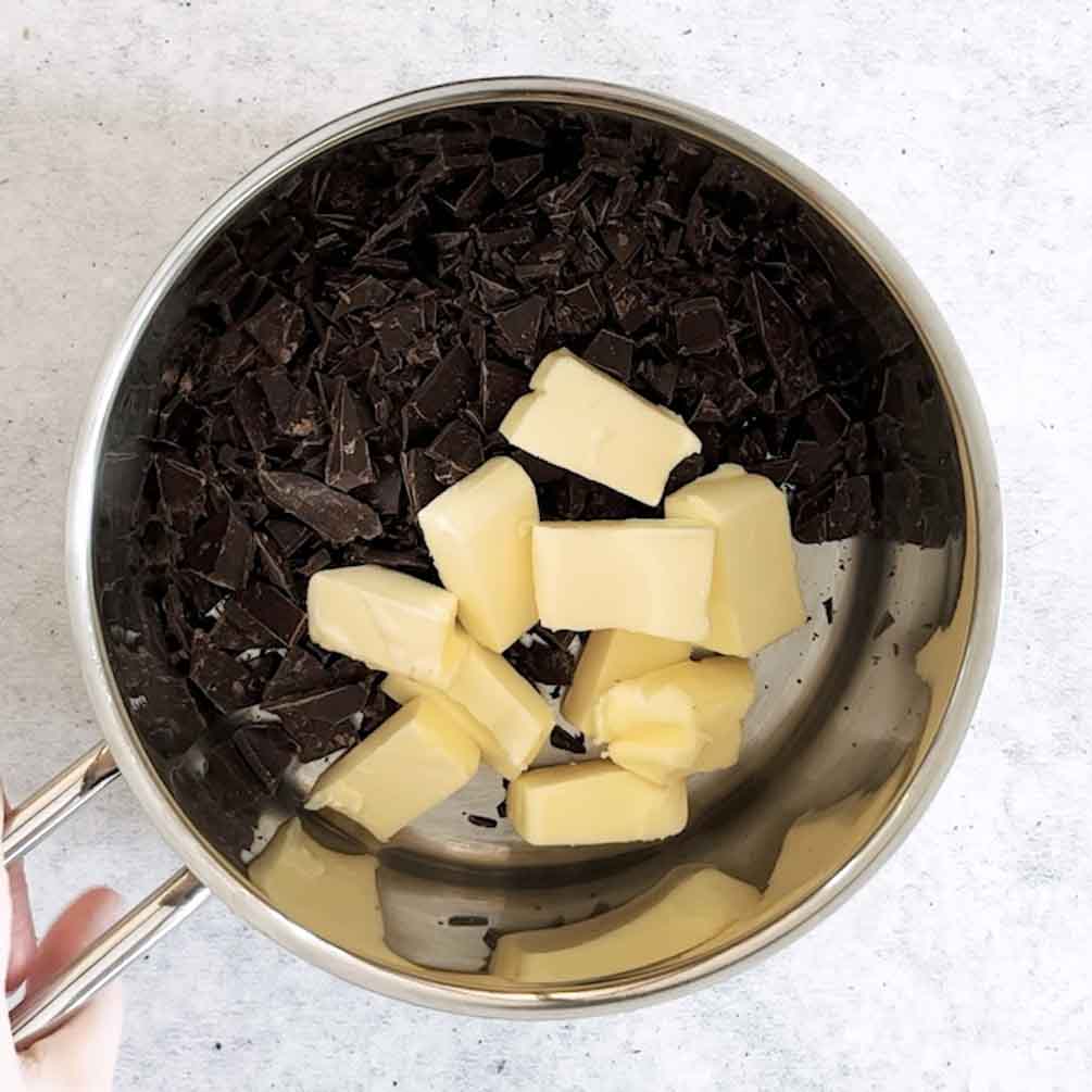 Melted chocolate and butter in a mixing bowl