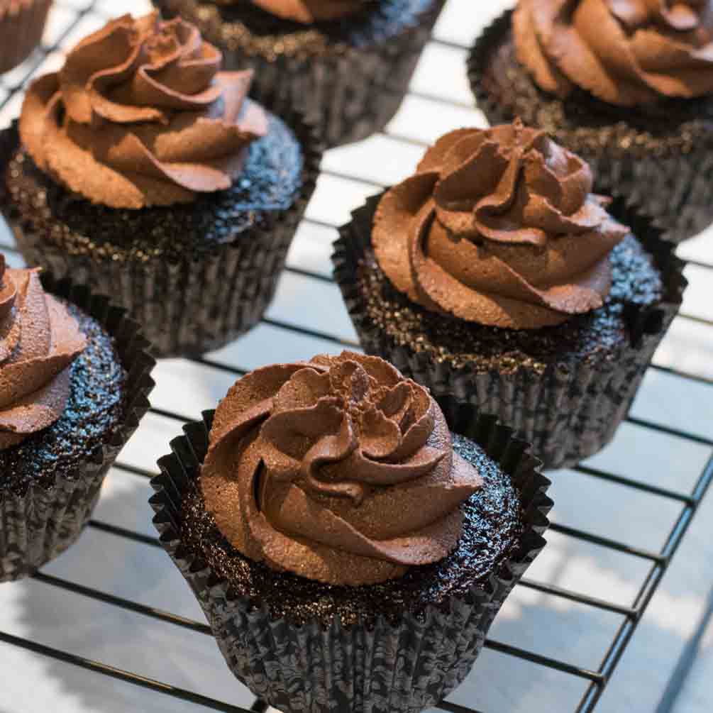 Frosted chocolate cupcake on a plate