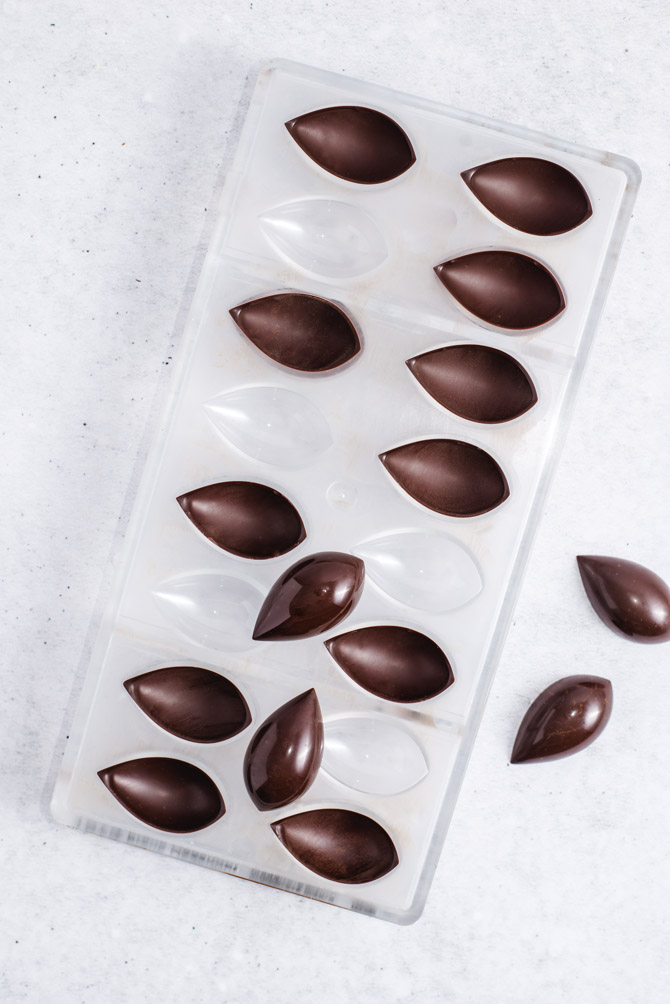 Tempered chocolate being poured into a mold