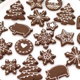Chocolate cookie dough cut with Christmas cookie cutters