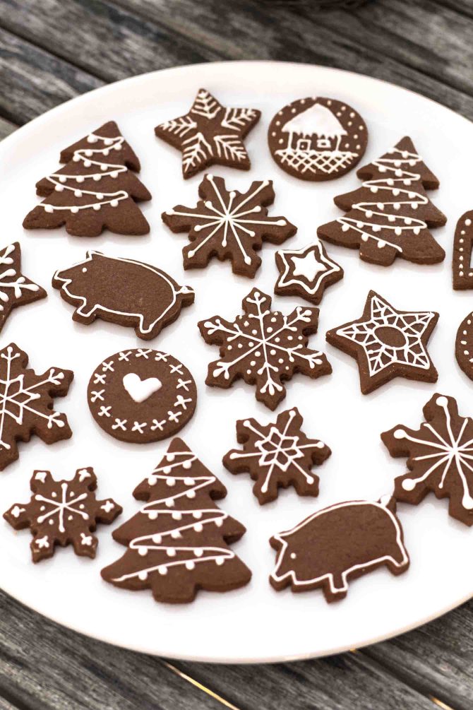 Chocolate cookie dough cut with Christmas cookie cutters