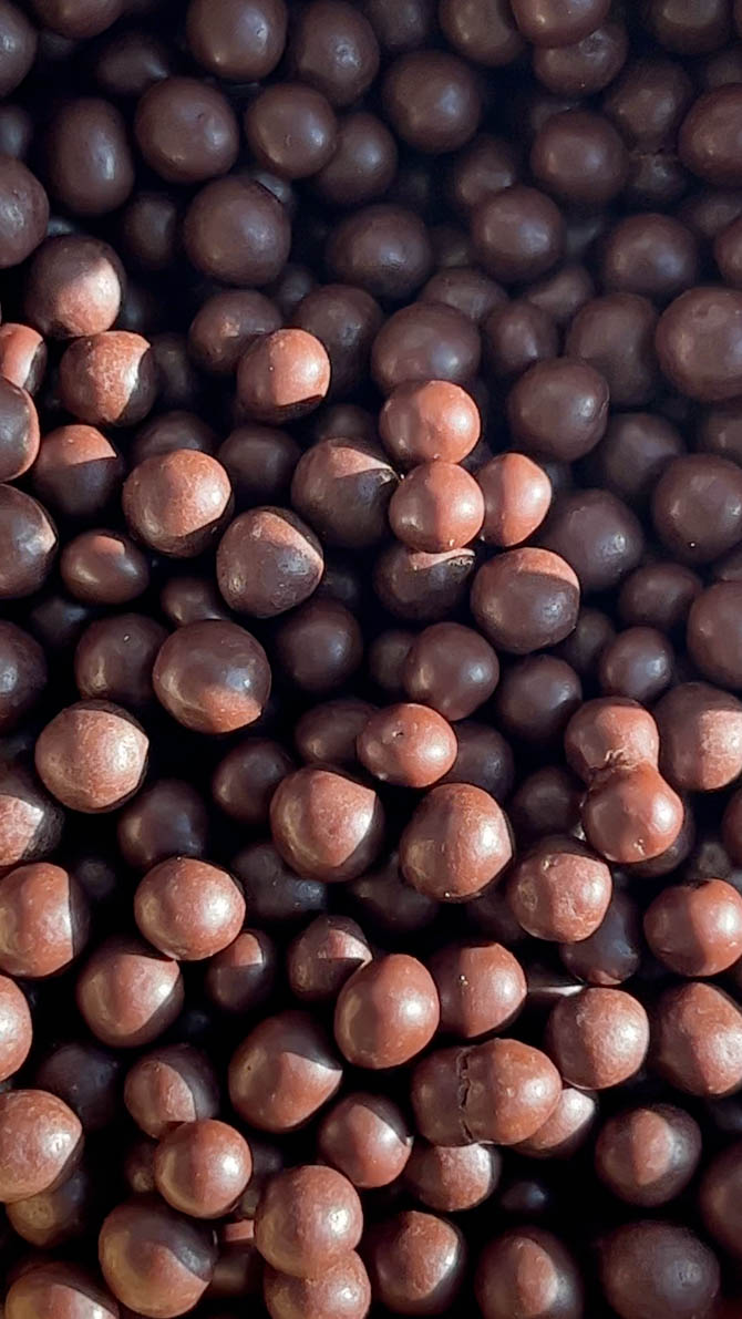 Bowl of Callebaut crisp pearls for marzipan eggs