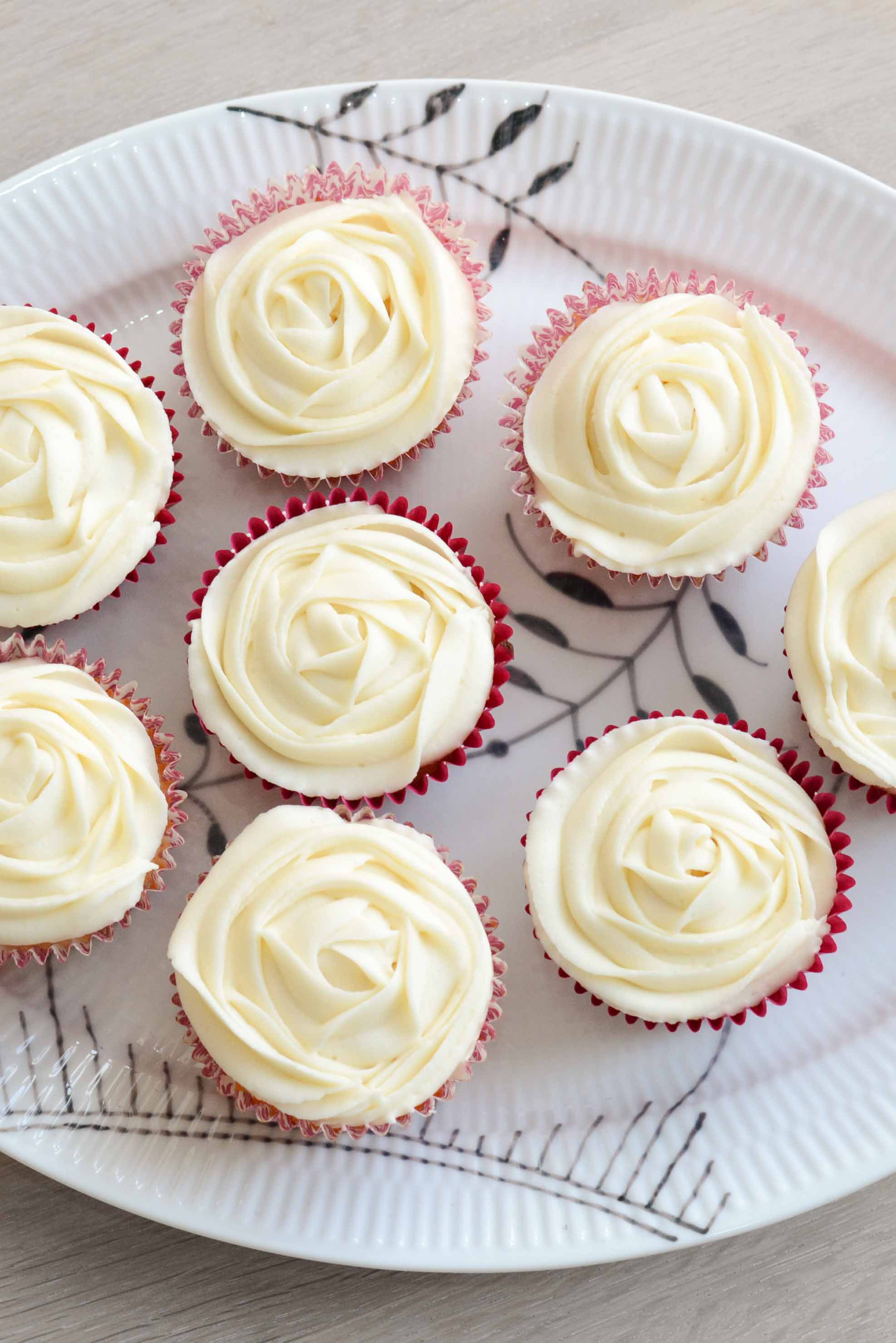 Lemon cupcakes with rose-piped vanilla buttercream frosting