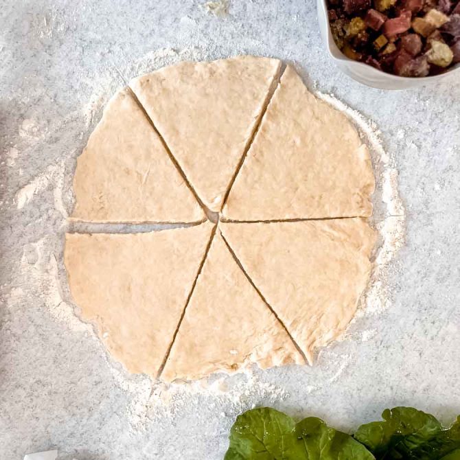 Cutting pastry dough into strips for rhubarb horns