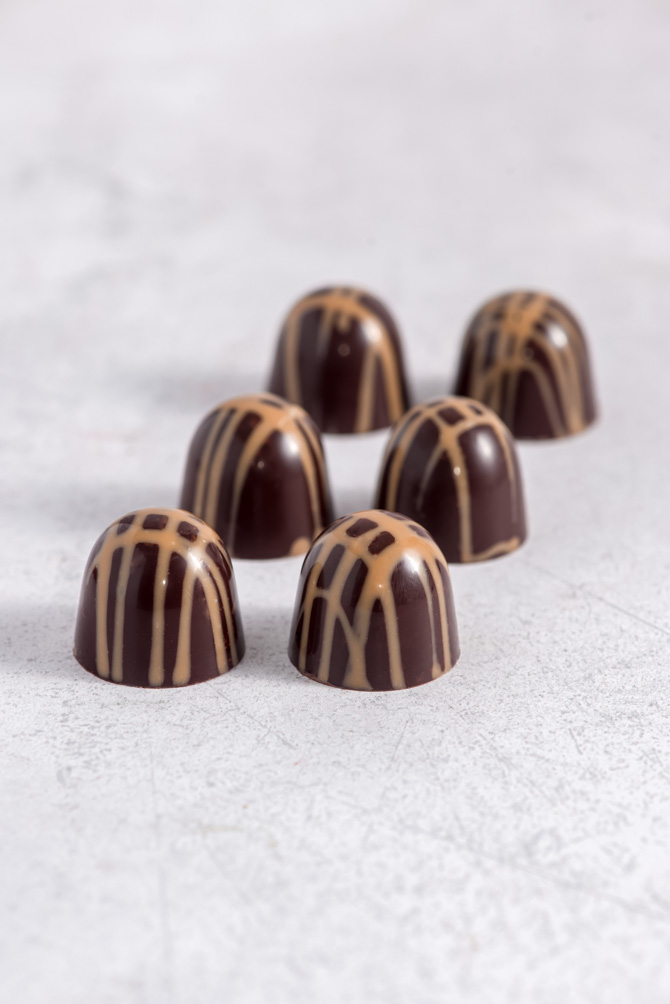 Glossy tempered chocolate pieces with a smooth shine
