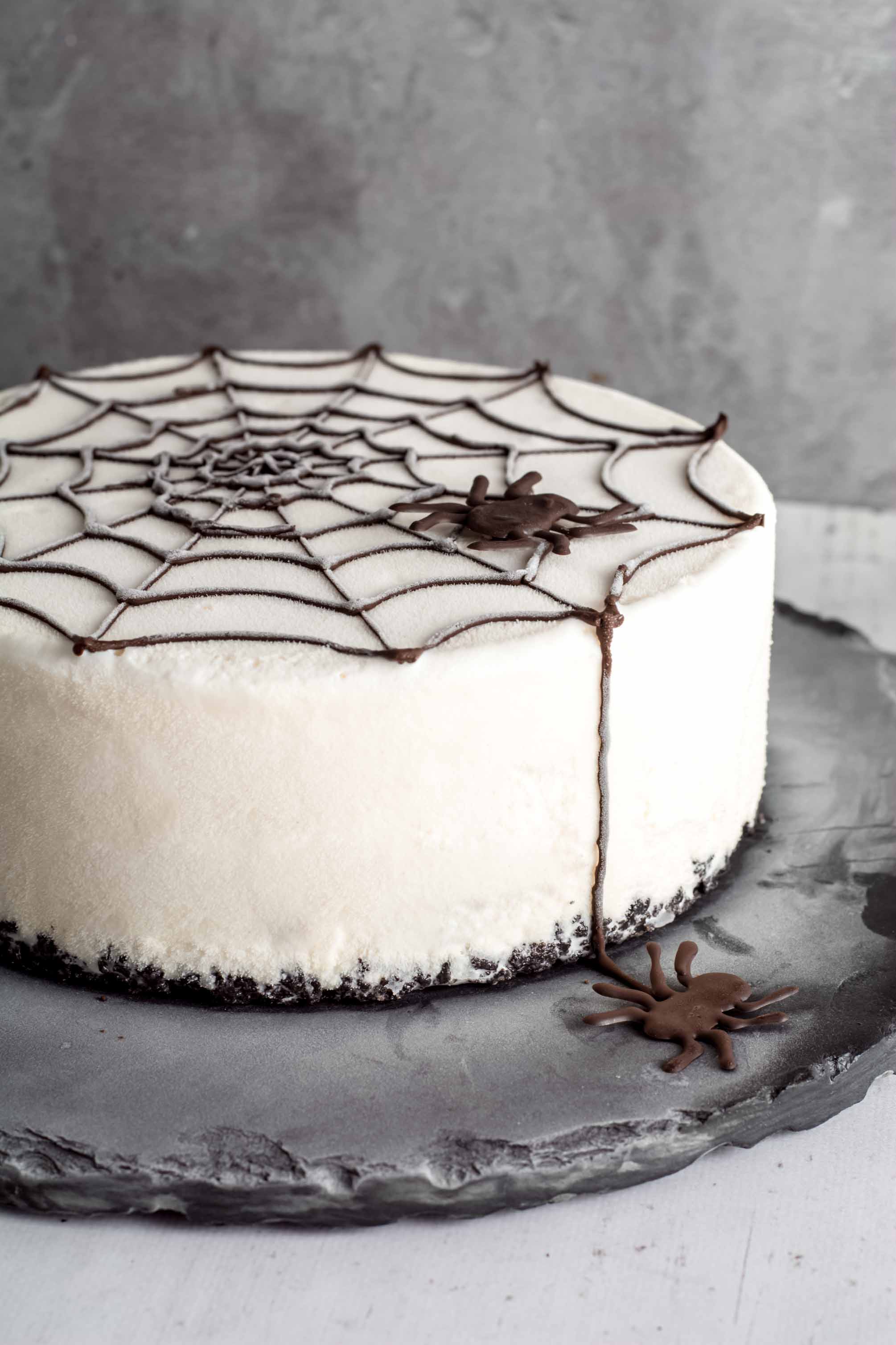 Slice of spider web ice cream cake on a plate