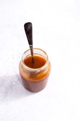 Salted caramel sauce dripping in a smooth stream