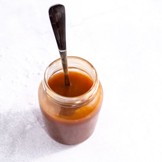 Salted caramel sauce dripping in a smooth stream
