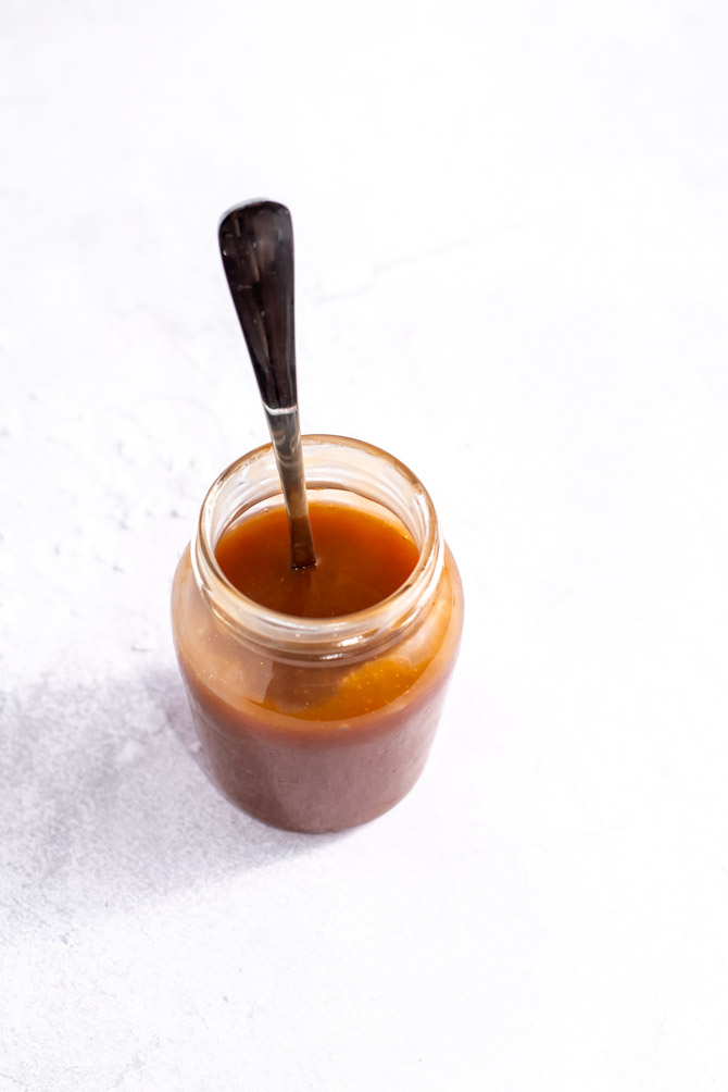 Salted caramel sauce dripping in a smooth stream