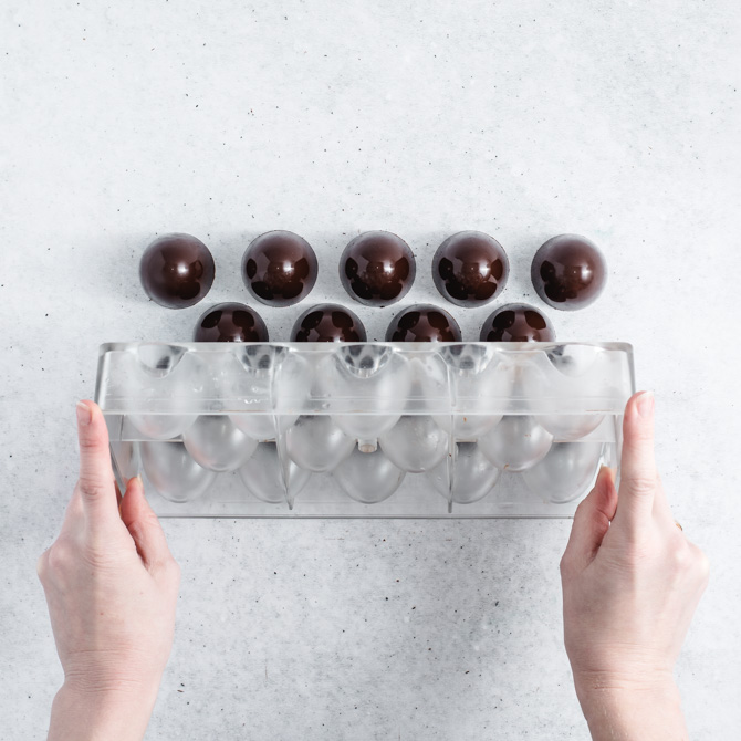 Pouring tempered chocolate into a mold