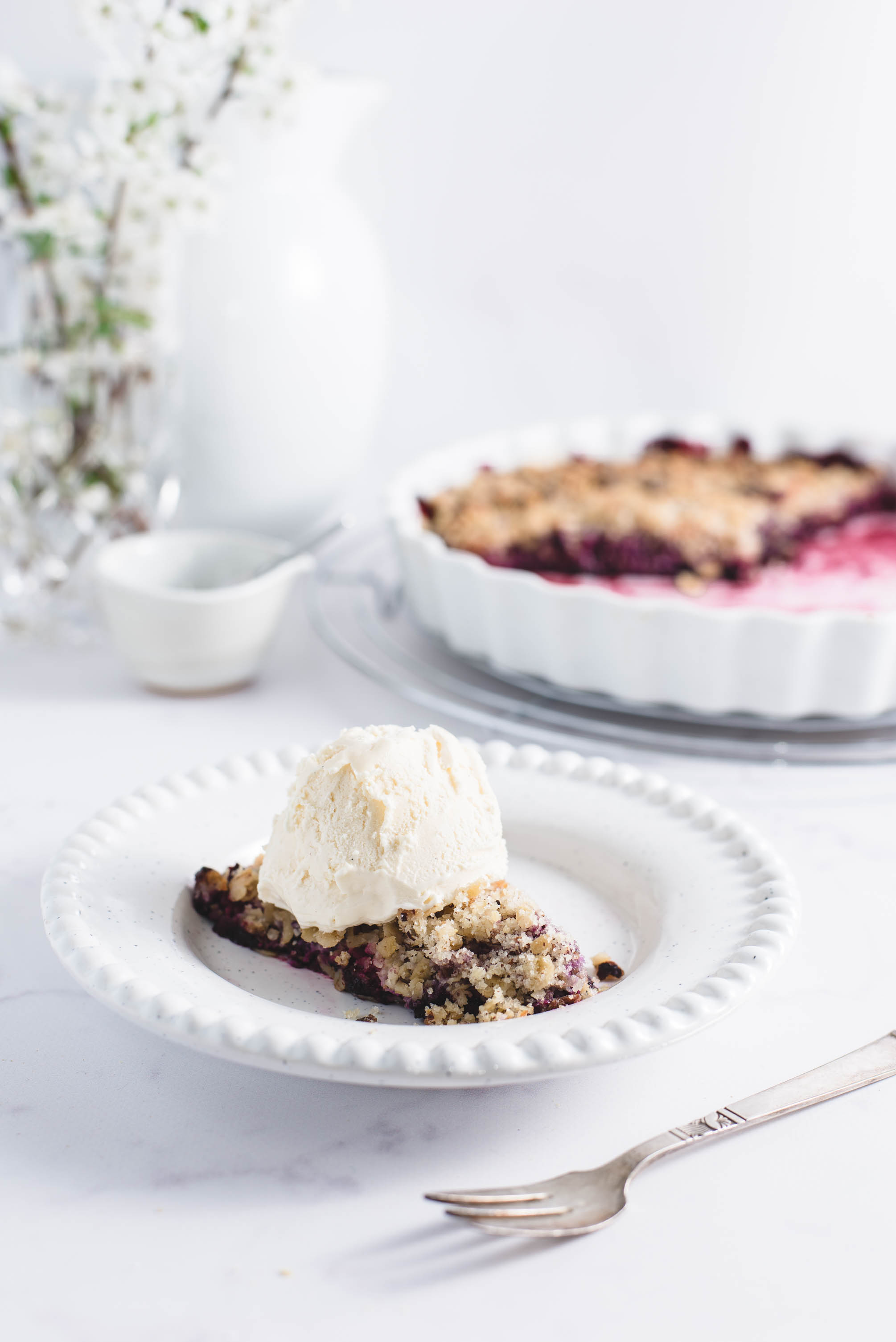 Raspberry crumble served with a scoop of ice cream