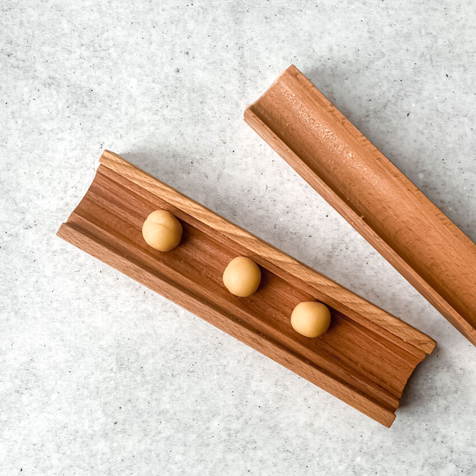 Rolling marzipan dough into egg shapes