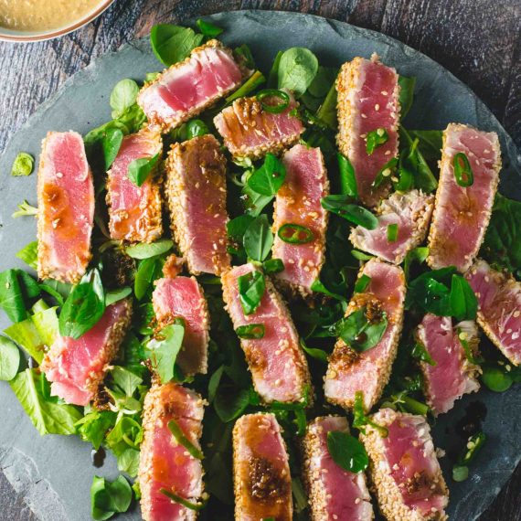 Sliced seared tuna appetizer with a seasoned crust