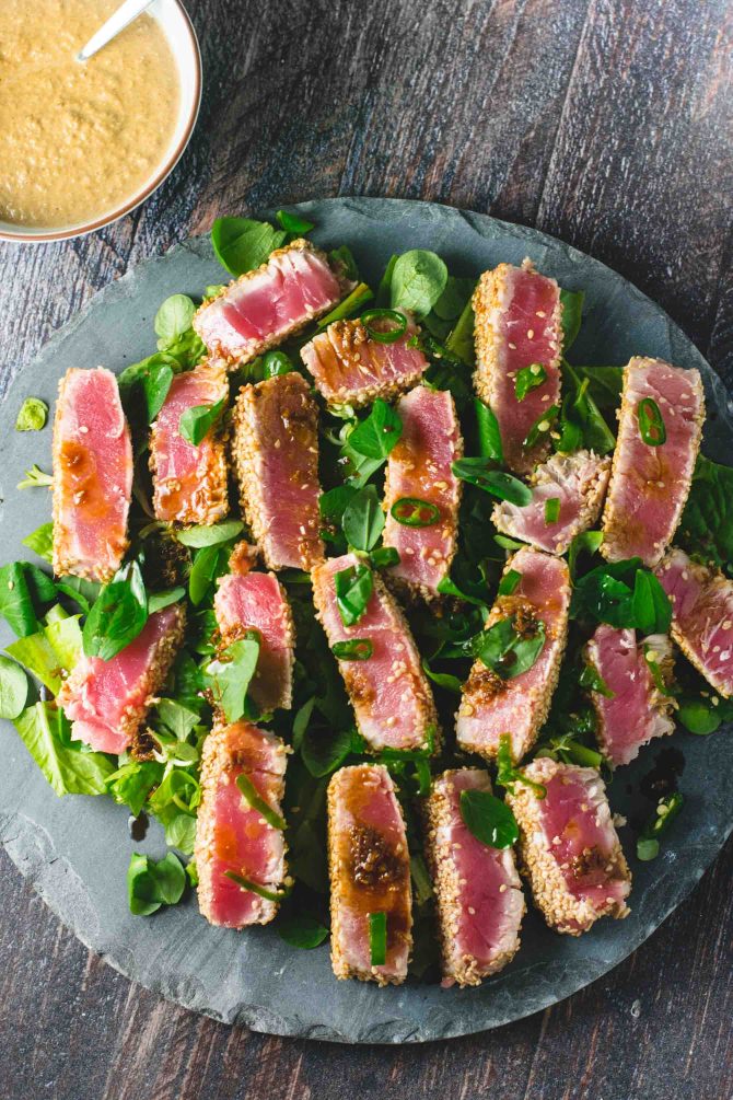 Sliced seared tuna appetizer with a seasoned crust