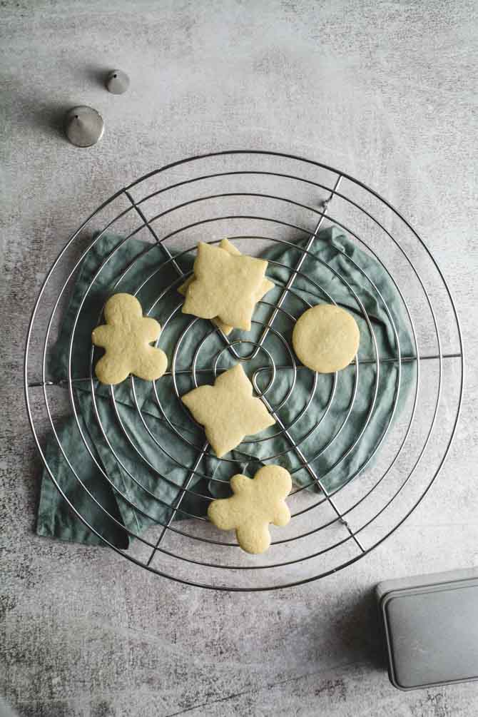 Vanilla cookie dough with Halloween-shaped cookie cutters