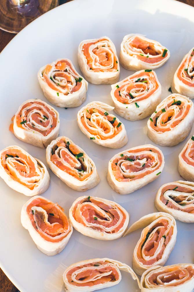 Wraps with salmon and cream cheese, shaped as roll-ups